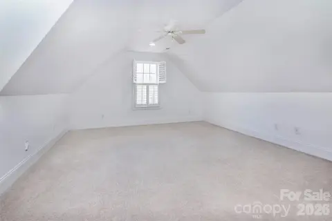 Upstairs large bonus room conveniently located by the two upstairs bedrooms - also has hardwood entry off hall - great for children playroom or relaxing room for guests!