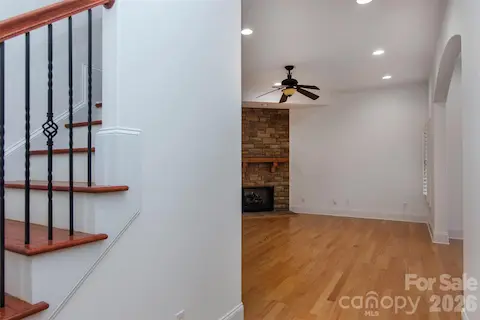 Hardwood staiirs/iron balusters to finished basement-10 ft ceilings, engineered wood flooring,stone fireplace,arched openings,flex room, BR 4,hall FBath, dbl French doors to private entry/patio