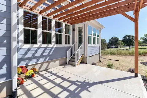 Enjoy the custom-built pergola, which serves as a peaceful outdoor space, enhancing both the aesthetic appeal and entertainment options for your home.