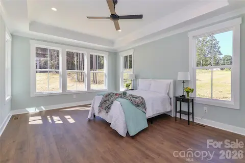 Drenched in natural light, the primary bedroom is spacious, peaceful retreat, offering a tranquil escape.
