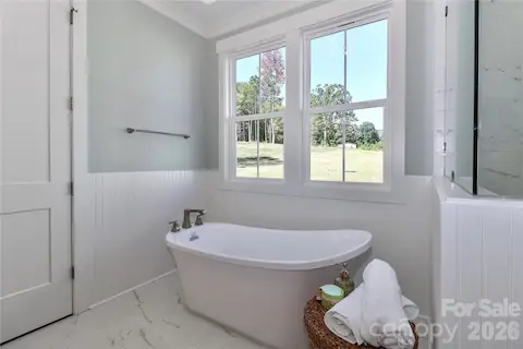 The primary bathroom is all about luxury and relaxation.