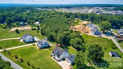 This beautiful home is perfectly situated in a desirable neighborhood, surrounded by stately custom-built properties, showcasing the area's unique character and attention to detail.
