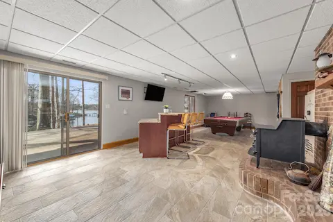 Large open recreation area with access to the patio and lake