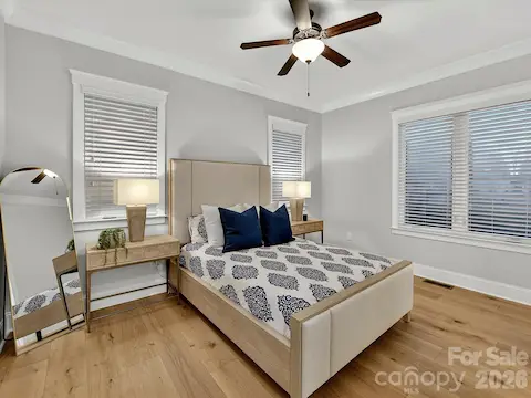 Comfortable first-floor guest suite offers abundant natural light, hardwood floors, and a welcoming retreat for family and overnight guests.