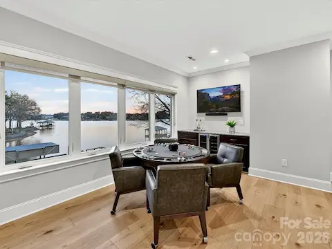 Spacious second-floor recreation room offers the perfect setting for billiards, games, entertaining, or relaxing while enjoying scenic lake views.