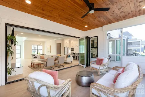 Beautiful pine ceiling makes this amazing screened in porch so cozy!