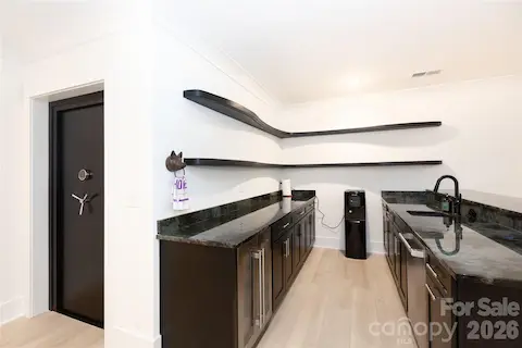 Entertaining bar w/Labradorite counters, beverage fridge and dishwasher