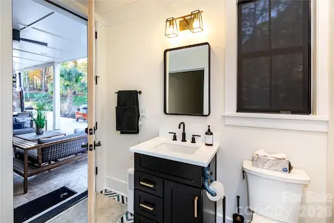 Bathroom opens to outside for easy access from the pool