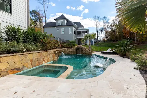 Saltwater pool with 2 waterfalls, tanning ledge & hot tub
