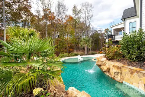 Saltwater pool with tanning ledge and seating bench