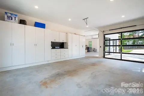Storage galore and workshop in the 3rd garage bay with plenty of room to park as well