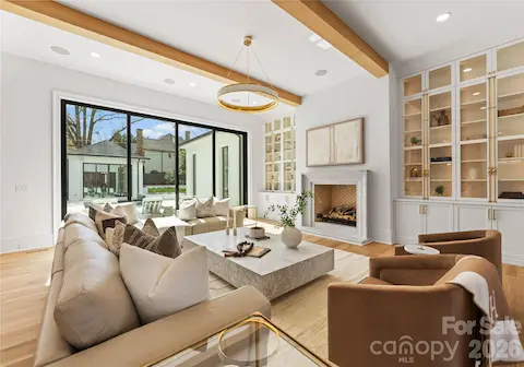 Open floor plan family room glows with natural light