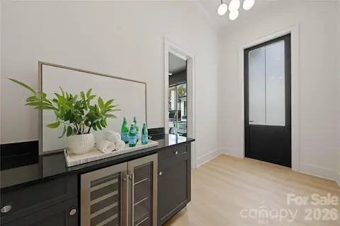 Near pool-Gym room with cabinet/counter