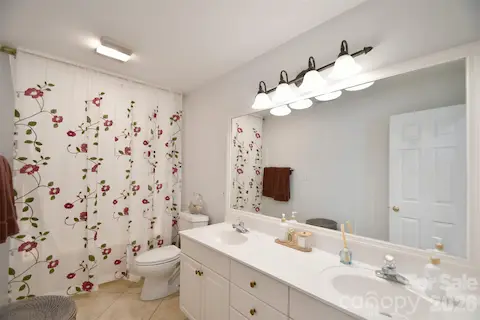 Full bathroom upstairs with two vanities