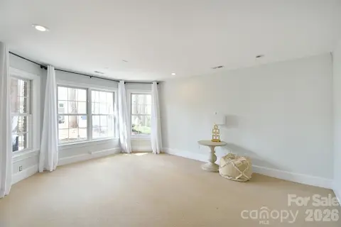 Lots of natural light and beautiful bay windows in this room in the basement