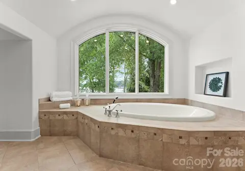 Garden tub in Bath 5 with lake view