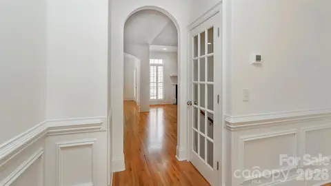French opens to staircase to basement: lg Great Room w/stone fp and open to office/exercise/band or future kitchen with dbl French doors to exterior patio. Completing basement: BR 4 and full bath.