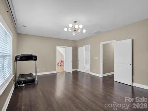 Bedroom with bonus room off of room