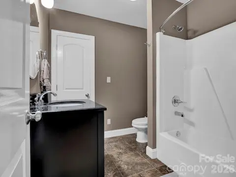 Full Bath lower level- opens into rec/main area and storage/flex space.