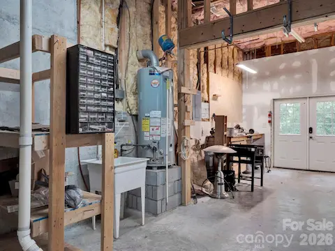Workshop/ flex space lower level/basement. Full bath connected to the room.