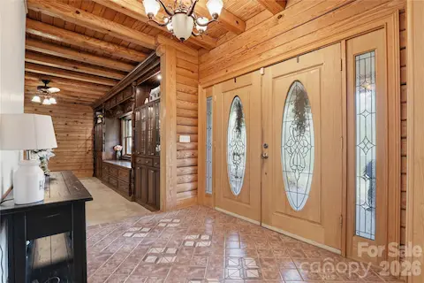 Front door from inside showing beautiful built-in - in the great room.