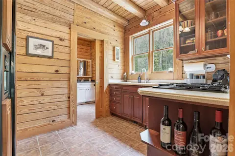 Sun Room Kitchen & 1/2 bath with private door to the pool and hot tub.