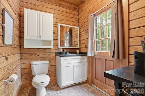 1/2 bath in Sun Room with private door to outside.