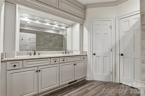 Primary Bathroom with double sinks with private water closet.