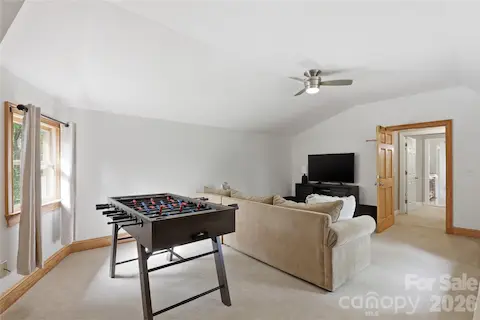 Living / game room that leads to 2nd living quarters.