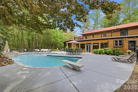 Gorgeous pool, cascading waterfall and hot tub with plenty of entertaining room.