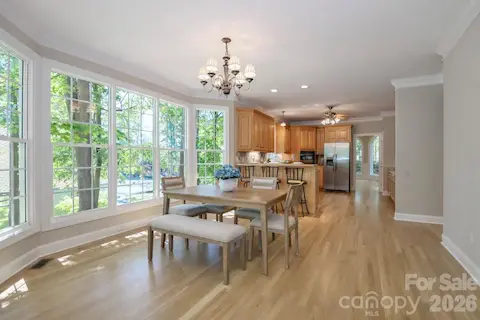 Spacious kitchen with dining area & views of the lake