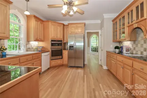 Kitchen with newly finished hardwood floors