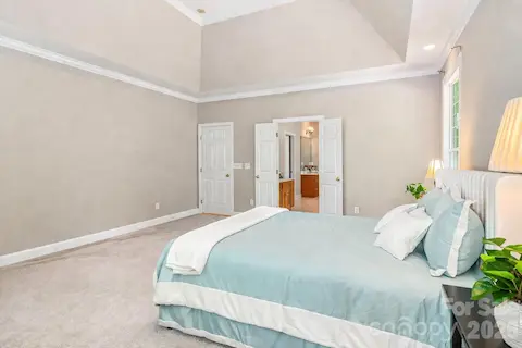 Beautiful Tray Ceiling in this spacious Primary Bedroom