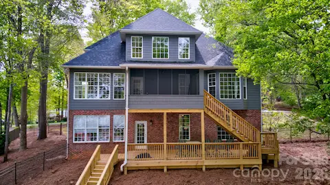 Gorgeous view of the back of the house from the lake.