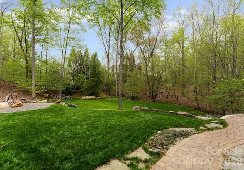 Terraced backyard and surrounded by additional greenspace