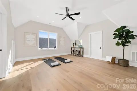 Third floor additional room with glass doors and ensuite bathroom