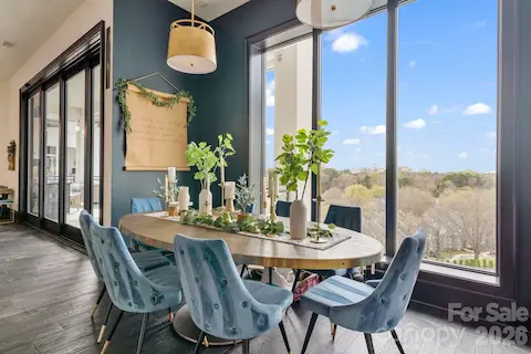 Dining area adjacent to the kitchen, offering its own custom built ins with reeded glass and plenty of storage for glass & dinnerware.