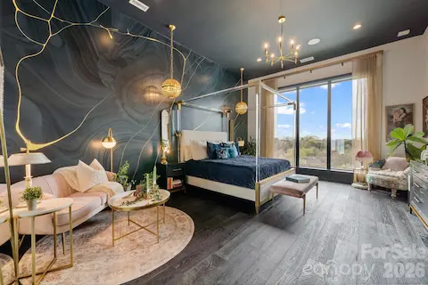 Oversized primary suite with automated blackout blinds, and more views over the treetops.