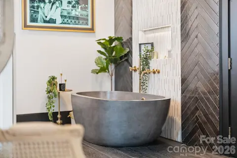 Stunning stone soaking tub, as seen in Taylor Sheridan's "The Madison!"
