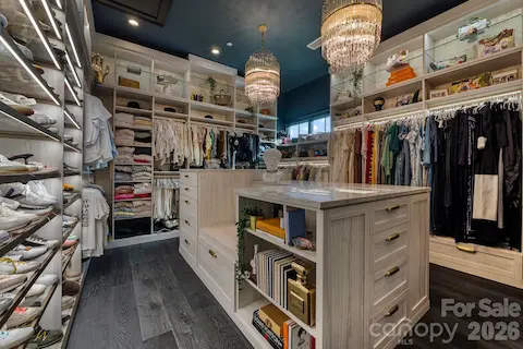 Primary closet has floor to ceiling storage.