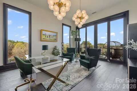 Stunning office with floor to ceiling windows and slider to private balcony.