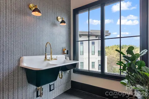 Beautiful tiled wall in laundry room.