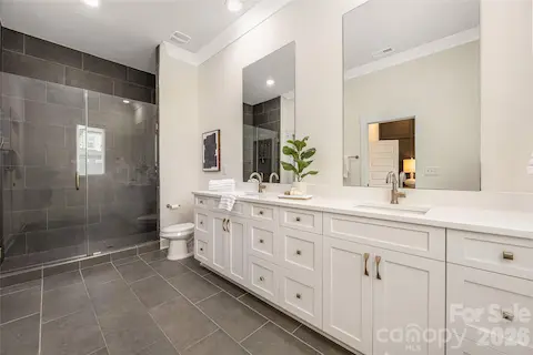 Primary Bath with floor to ceiling tile in shower