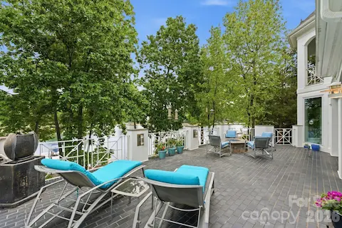Terrace off of kitchen and dining room with water views and firepit