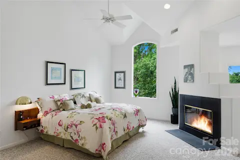 Primary suite with fireplace, sitting area and private balcony