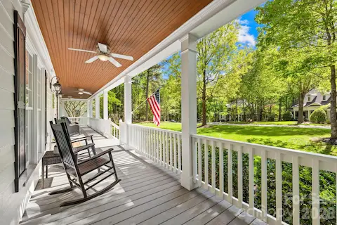 The sprawling rocking chair front porch that wraps around to the side deck.