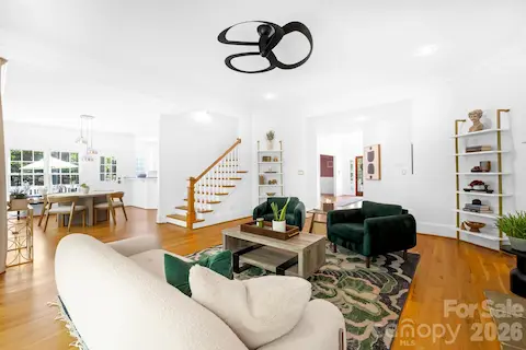 The living room is open to the kitchen dining space.