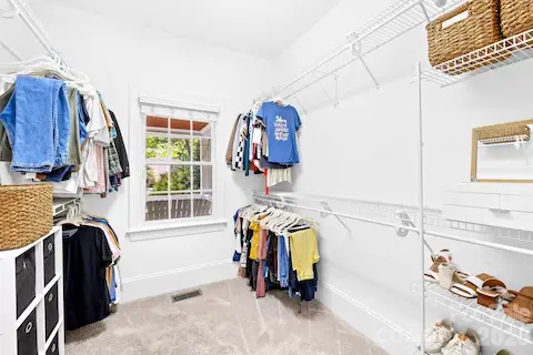 Primary bedroom walk-in closet.