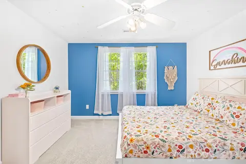 Bedroom 4 overlooks the backyard and has a closet with access to some attic storage.