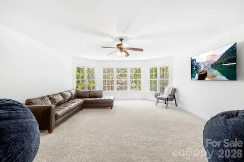Bonus room with French doors is on the upper level can make a great playroom, additional guest room or flex space. It overlooks the backyard.